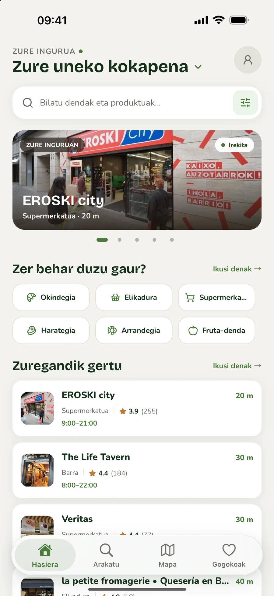 Auzokoren hasierako pantaila, bilaketa, kategoriak eta gertuko dendak erakusten dituena.
